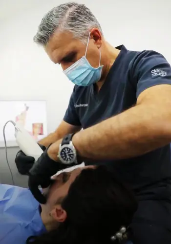 Dr. Firas Hamzeh treating a patient at the clinic